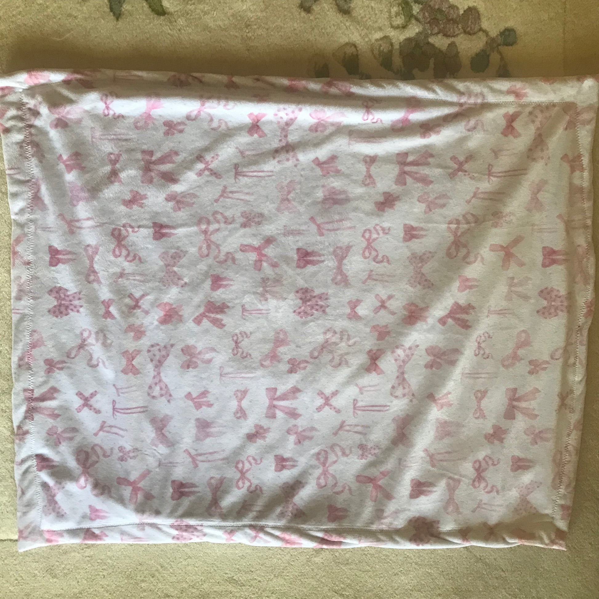 White blanket with pink bows