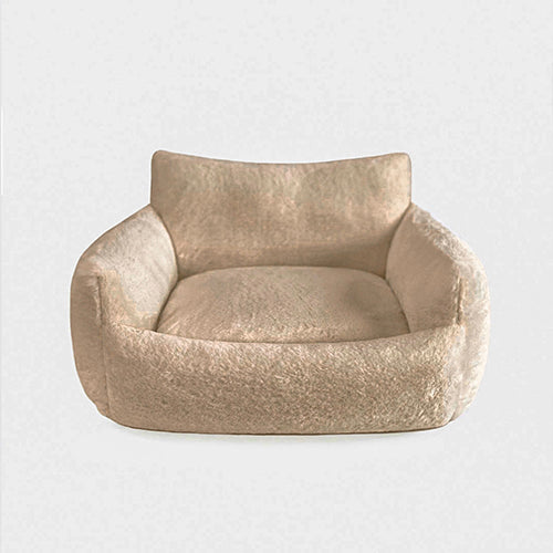 Beige pet bed on a white background