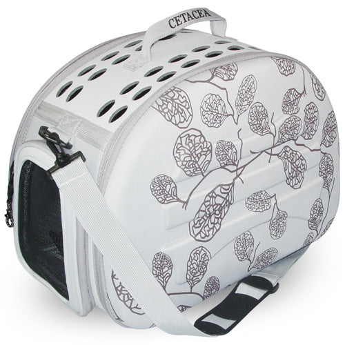 hard shell Pet carrier with leaf pattern on a white background