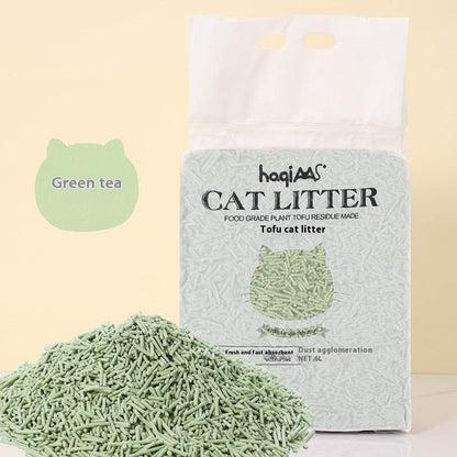 Tofu cat litter with packaging labeled 'Green tea' and brand 'haqiaas' on a light background.