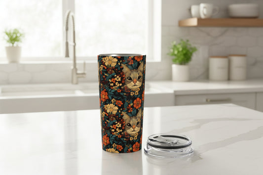 Tumbler with cat and floral design on a white background