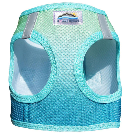 Turquoise dog harness with reflective stripes on a white background