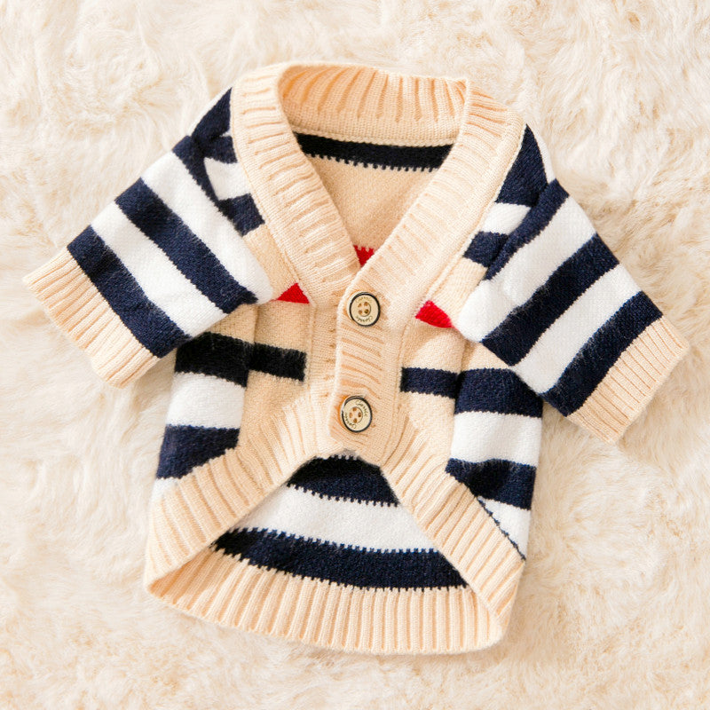 Knitted cardigan with navy and white stripes on a soft beige background