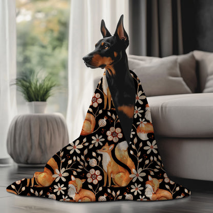 Dog draped over a floral-patterned blanket in a living room setting