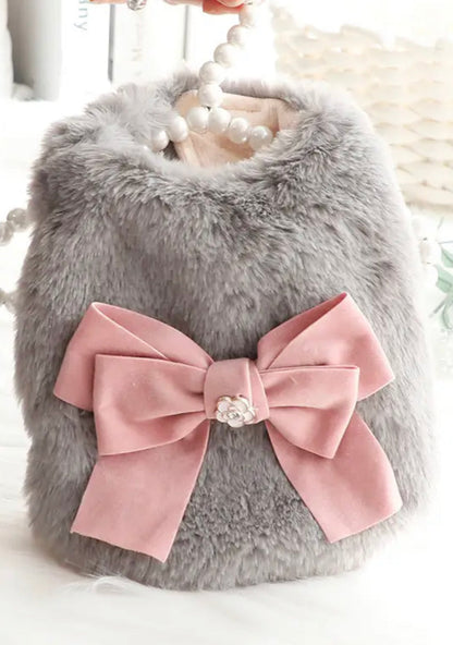 Gray fluffy pet coat with a pink bow and pearl embellishment on a white background