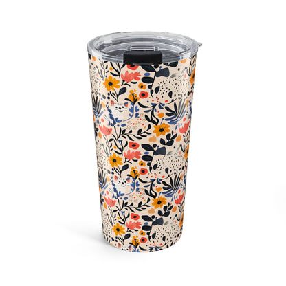 Floral-patterned tumbler with a clear lid on a white background