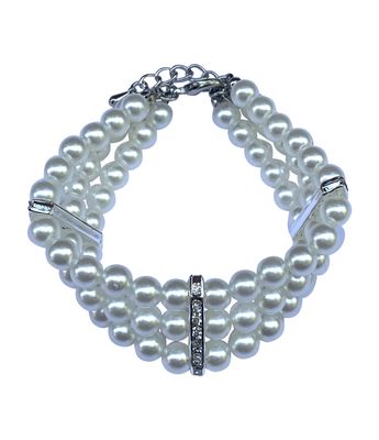 Pearl dog necklace with silver clasp on a white background