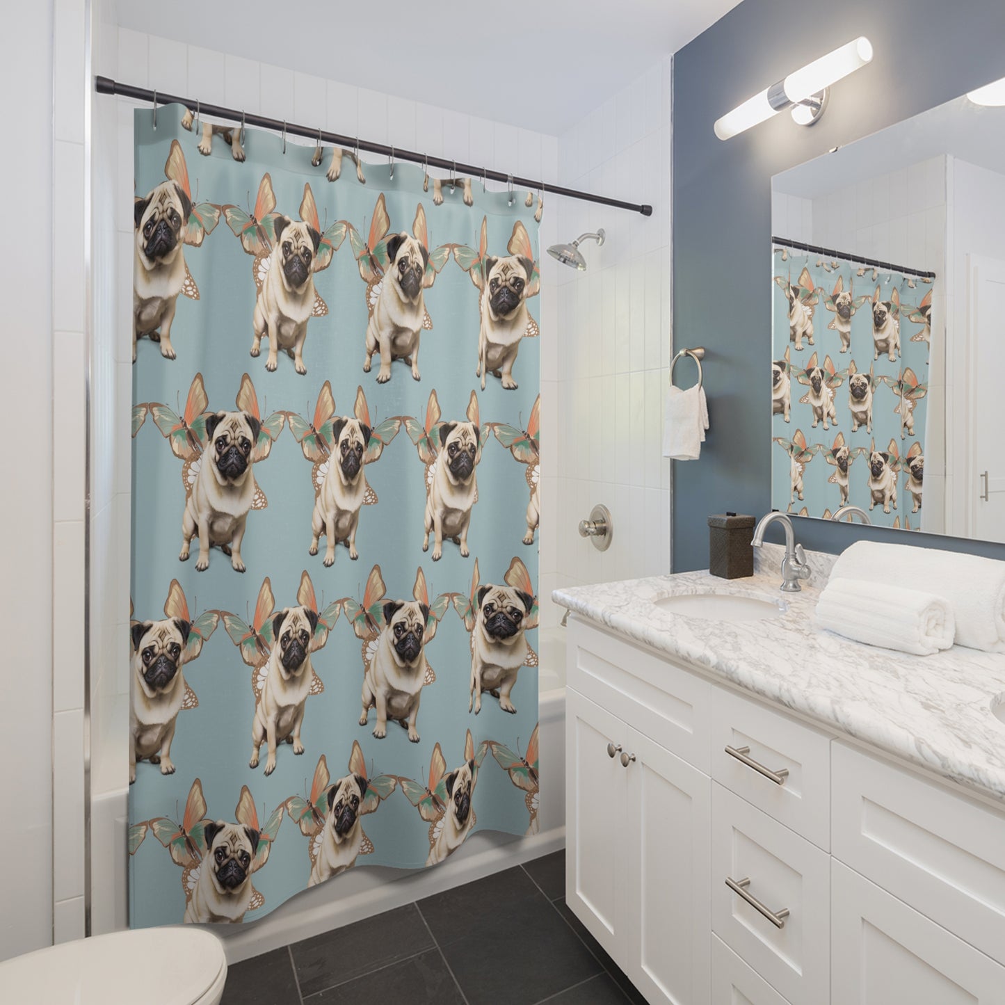 a bathroom scene with white vanity and a shower curtain featuring pugs and butterflies